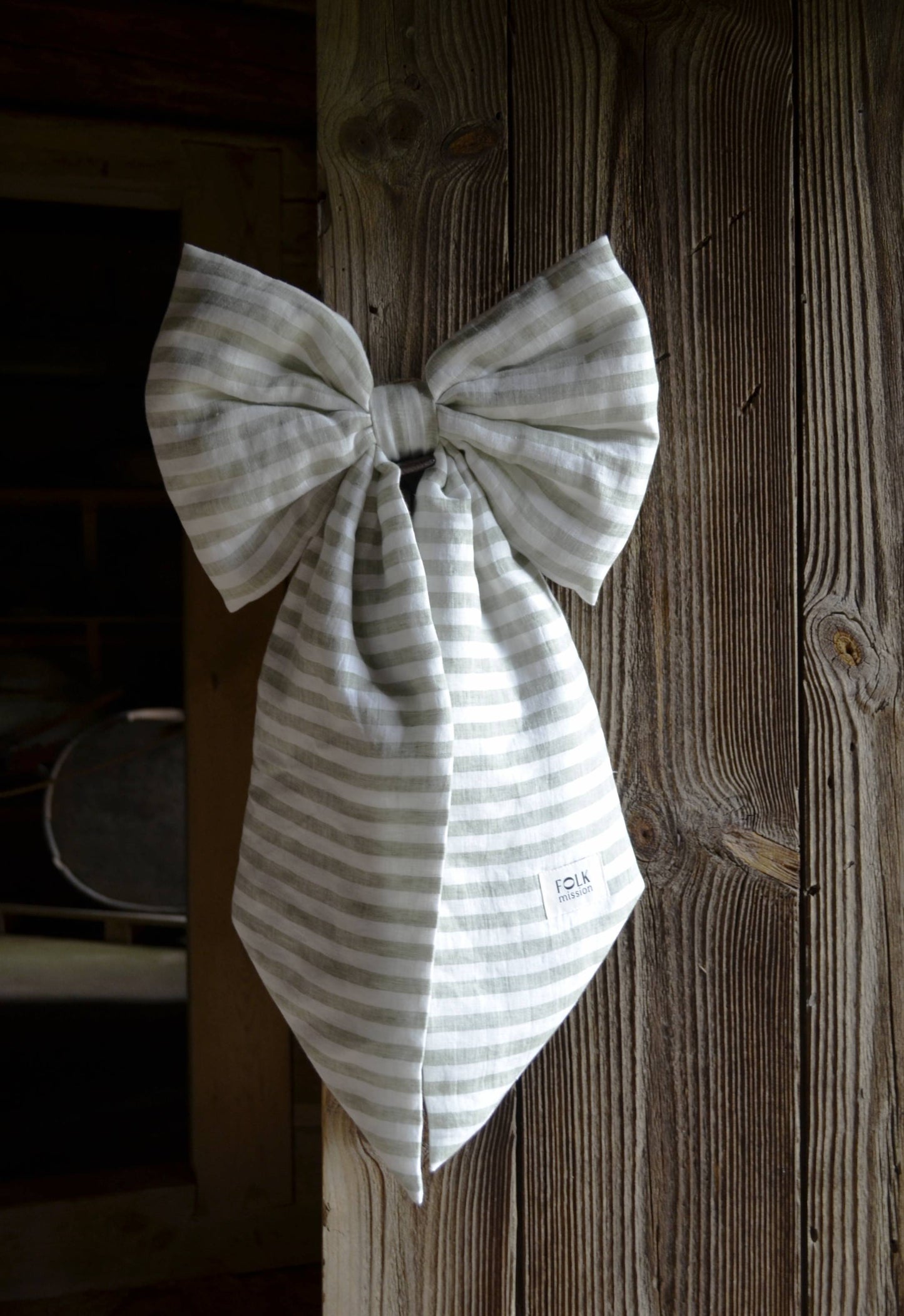 Striped bow tie on a wooden surface